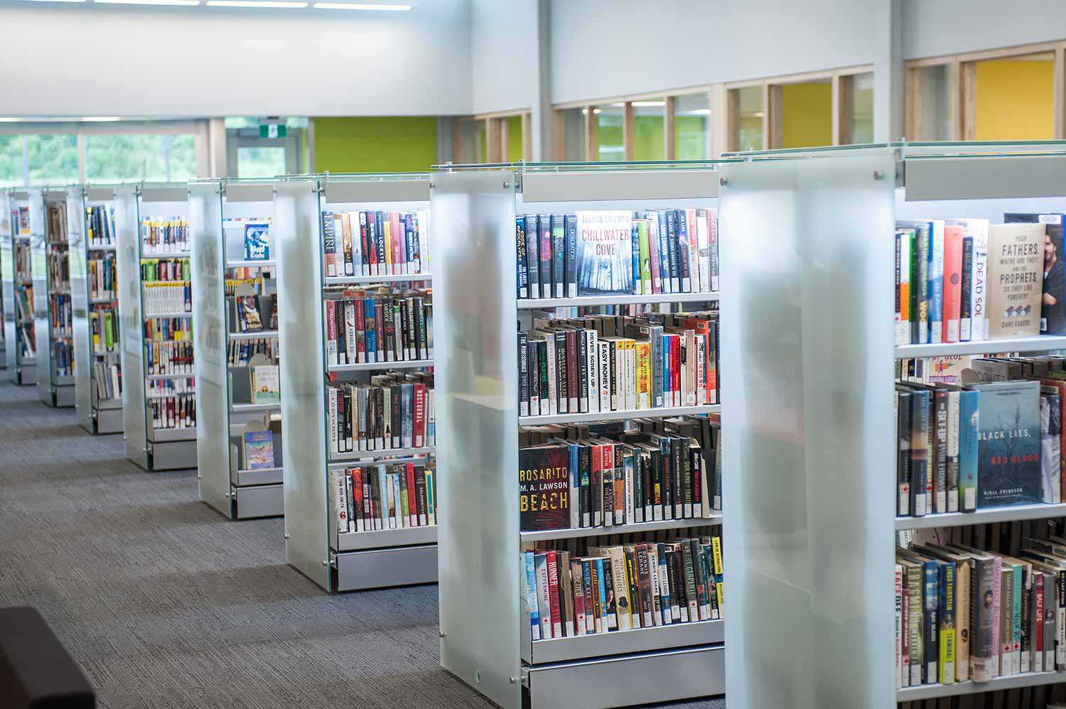 Modern book stacks and bright, open space at the Lakeshore Branch of the Innisfil ideaLAB & Library